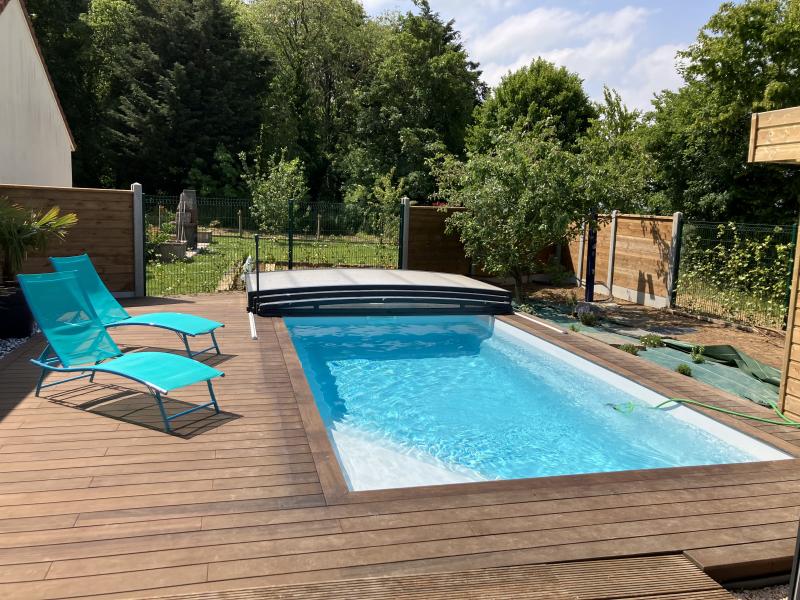 En exclusivité, l'installation d'une piscine Celestine 6 Alliance Piscine avec abri Abrisud